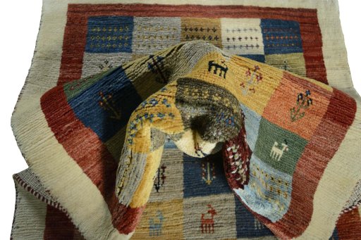 Corner detail of New Persian Gabbeh rug showing border pattern and Wool pile
