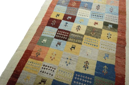 Backside of handmade New Persian Gabbeh rug showing knot structure and weave density