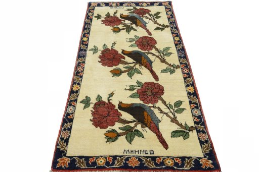 Surface texture of 2000s Persian Gabbeh rug with natural Wool and intricate pattern