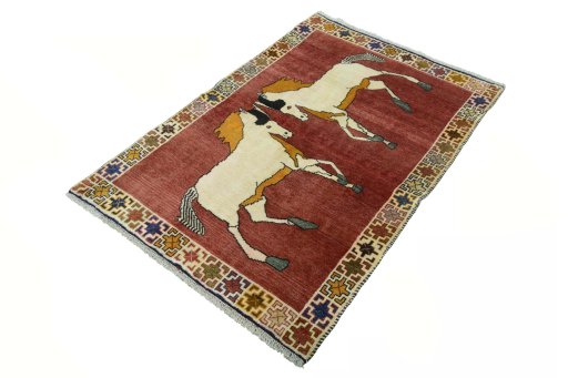 Corner detail of 2000s Persian Gabbeh rug showing border pattern and Wool pile