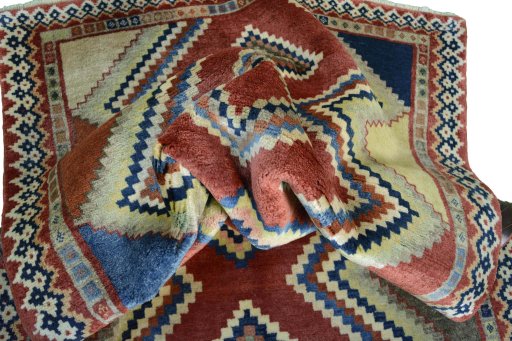 Corner detail of 2000s Persian Gabbeh rug showing border pattern and Wool pile