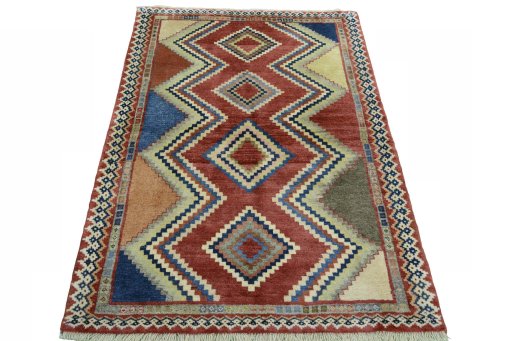 Surface texture of 2000s Persian Gabbeh rug with natural Wool and intricate pattern