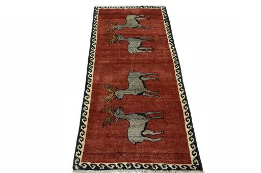 Surface texture of 2000s Persian Gabbeh rug with natural Wool and intricate pattern