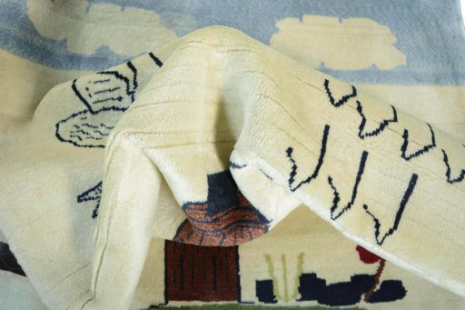 Corner detail of 2000s Persian Gabbeh rug showing border pattern and Wool pile