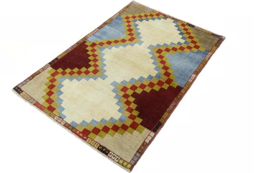 Corner detail of 2000s Persian Gabbeh rug showing border pattern and Wool pile