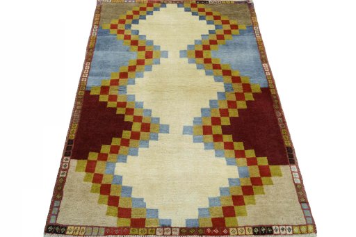Surface texture of 2000s Persian Gabbeh rug with natural Wool and intricate pattern