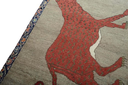 Backside of handmade 2000s Persian Gabbeh rug showing knot structure and weave density