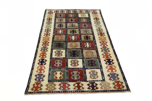 Surface texture of 2000s Persian Gabbeh rug with natural Wool and intricate pattern