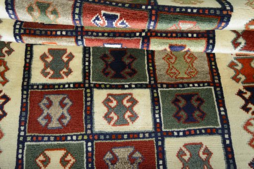 Full view of 2000s Persian Gabbeh rug from Iran / Persia, 165 × 107 cm in Multi Color tones