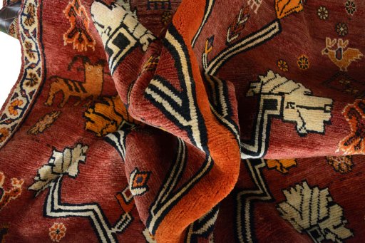 Corner detail of 2000s Persian Gabbeh rug showing border pattern and Wool pile