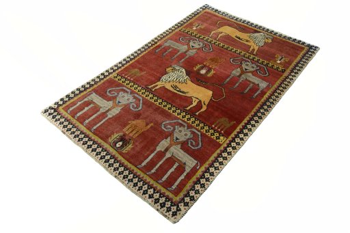 Corner detail of 2000s Persian Gabbeh rug showing border pattern and Wool pile