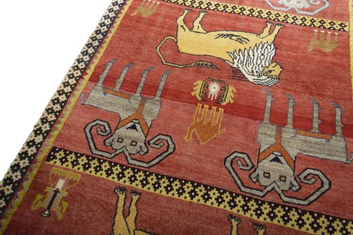 Backside of handmade 2000s Persian Gabbeh rug showing knot structure and weave density