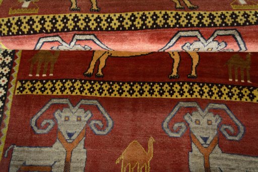 Full view of 2000s Persian Gabbeh rug from Iran / Persia, 190 × 112 cm in Red tones