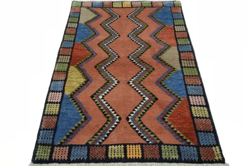 Surface texture of 2000s Persian Gabbeh rug with natural Wool and intricate pattern