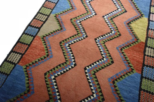Backside of handmade 2000s Persian Gabbeh rug showing knot structure and weave density