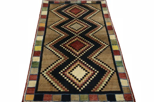 Surface texture of 2000s Persian Gabbeh rug with natural Wool and intricate pattern