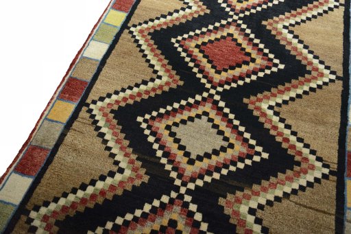 Backside of handmade 2000s Persian Gabbeh rug showing knot structure and weave density