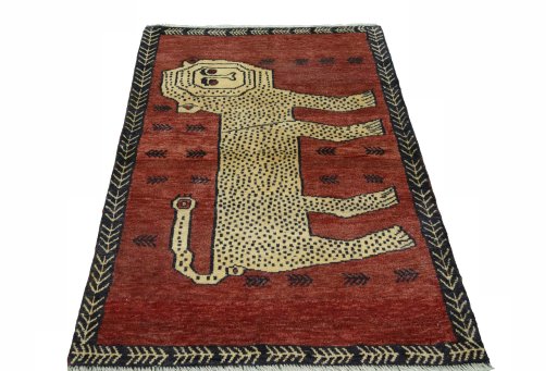 Surface texture of 2000s Persian Gabbeh rug with natural Wool and intricate pattern