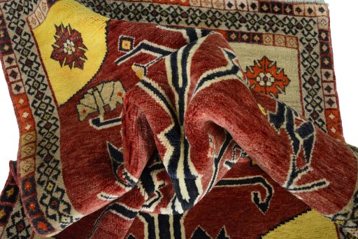 Corner detail of 2000s Persian Gabbeh rug showing border pattern and Wool pile