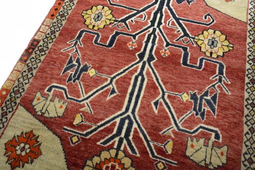 Backside of handmade 2000s Persian Gabbeh rug showing knot structure and weave density