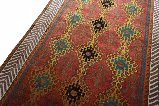 Backside of handmade 2000s Persian Gabbeh rug showing knot structure and weave density
