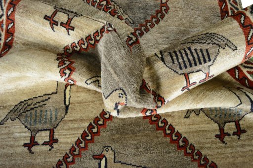 Corner detail of 2000s Persian Gabbeh rug showing border pattern and Wool pile