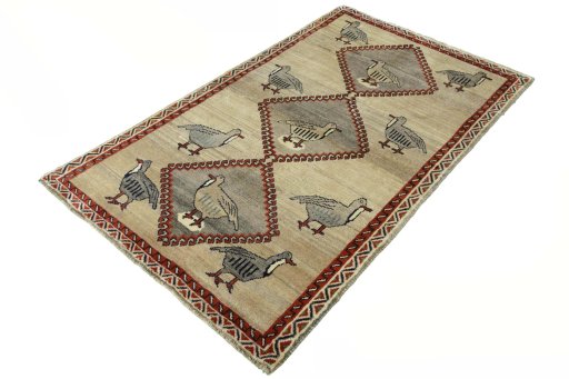 Corner detail of 2000s Persian Gabbeh rug showing border pattern and Wool pile