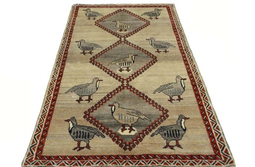 Surface texture of 2000s Persian Gabbeh rug with natural Wool and intricate pattern