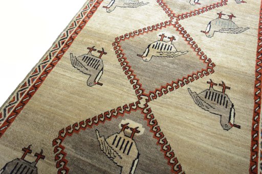 Backside of handmade 2000s Persian Gabbeh rug showing knot structure and weave density