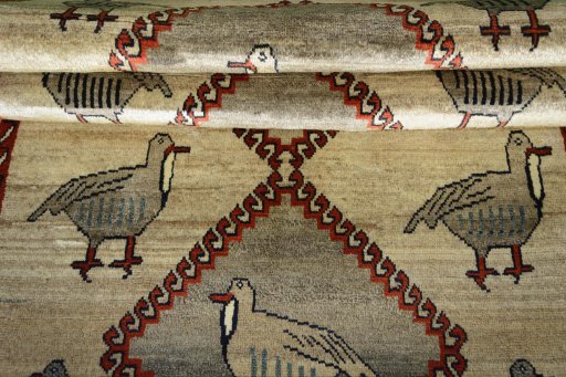 Full view of 2000s Persian Gabbeh rug from Iran / Persia, 202 × 117 cm in Beige tones