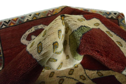 Corner detail of 2000s Persian Gabbeh rug showing border pattern and Wool pile