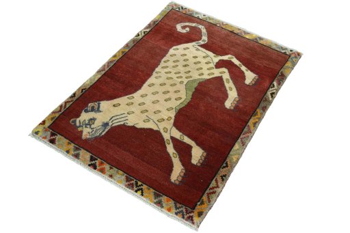 Corner detail of 2000s Persian Gabbeh rug showing border pattern and Wool pile