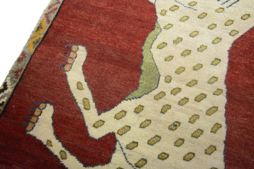 Backside of handmade 2000s Persian Gabbeh rug showing knot structure and weave density