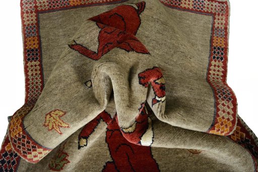 Corner detail of 2000s Persian Gabbeh rug showing border pattern and Wool pile