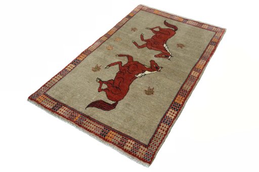 Corner detail of 2000s Persian Gabbeh rug showing border pattern and Wool pile
