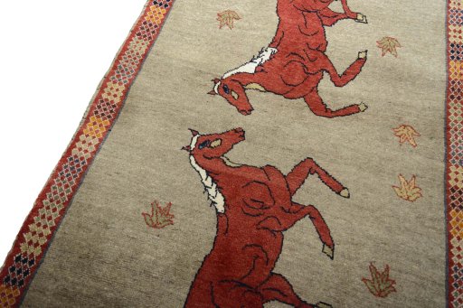 Backside of handmade 2000s Persian Gabbeh rug showing knot structure and weave density