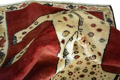 Corner detail of 2000s Persian Gabbeh rug showing border pattern and Wool pile