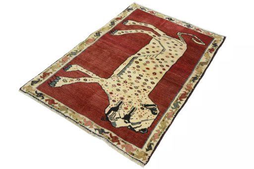 Corner detail of 2000s Persian Gabbeh rug showing border pattern and Wool pile