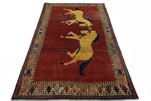Surface texture of 2000s Persian Gabbeh rug with natural Wool and intricate pattern