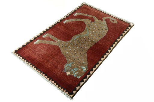 Corner detail of 2000s Persian Gabbeh rug showing border pattern and Wool pile