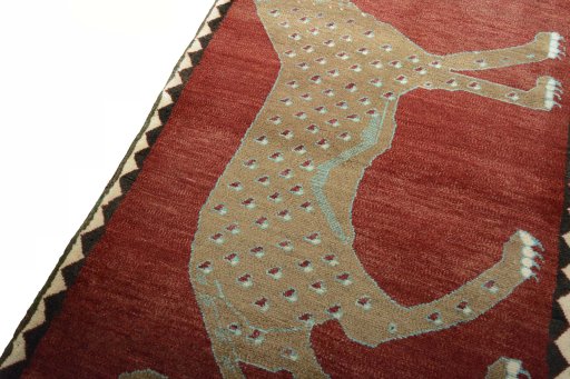Backside of handmade 2000s Persian Gabbeh rug showing knot structure and weave density
