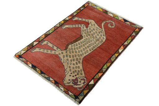 Corner detail of 2000s Persian Gabbeh rug showing border pattern and Wool pile