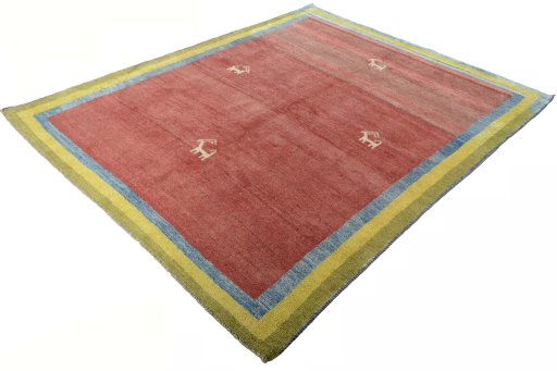 Corner detail of 2000s Persian Gabbeh rug showing border pattern and Wool pile