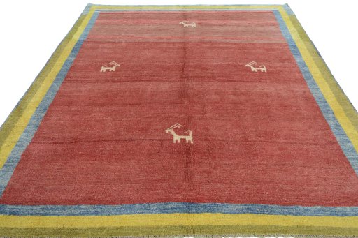Surface texture of 2000s Persian Gabbeh rug with natural Wool and intricate pattern