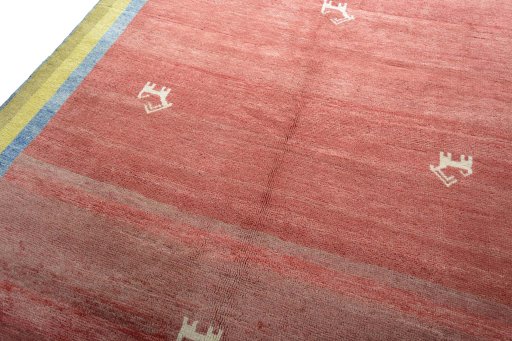 Backside of handmade 2000s Persian Gabbeh rug showing knot structure and weave density