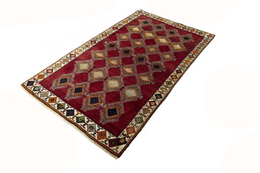 Corner detail of 2000s Persian Gabbeh rug showing border pattern and Wool pile