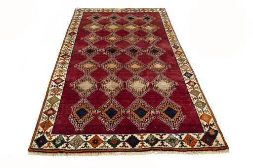 Surface texture of 2000s Persian Gabbeh rug with natural Wool and intricate pattern
