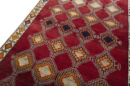Backside of handmade 2000s Persian Gabbeh rug showing knot structure and weave density