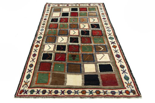 Surface texture of 2000s Persian Gabbeh rug with natural Wool and intricate pattern