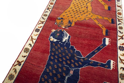 Backside of handmade 2000s Persian Gabbeh rug showing knot structure and weave density